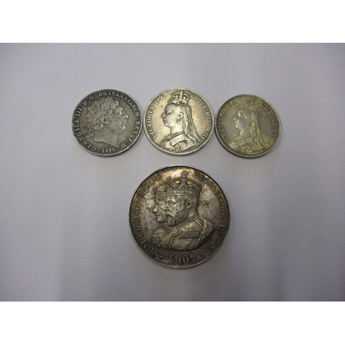 138 - A parcel of silver coins and a medal, to include a George III crown1819, a Victorian crown 1890, a d... 