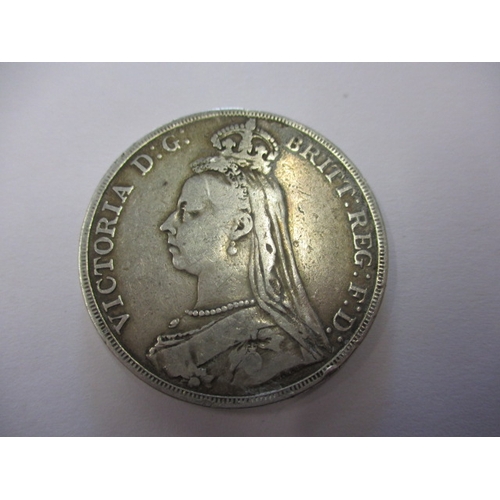 138 - A parcel of silver coins and a medal, to include a George III crown1819, a Victorian crown 1890, a d... 