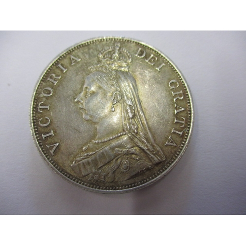 138 - A parcel of silver coins and a medal, to include a George III crown1819, a Victorian crown 1890, a d... 