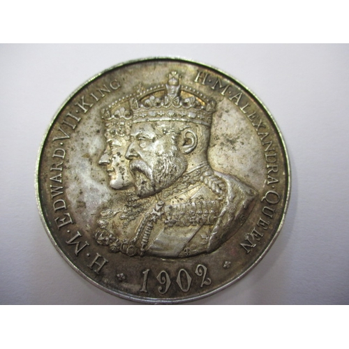 138 - A parcel of silver coins and a medal, to include a George III crown1819, a Victorian crown 1890, a d... 