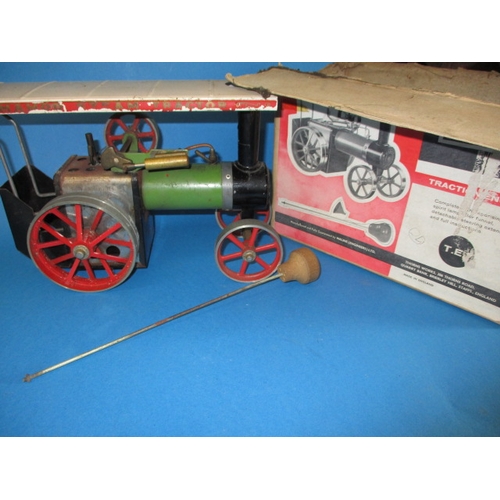 301 - A vintage Mamod TE1 live steam traction engine, with fire pan, steering rod and box, in used conditi... 