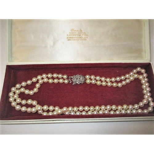 140 - A vintage 2 strand pearl necklace with 9ct diamond set clasp, approx. linear length 46cm, approx. be... 