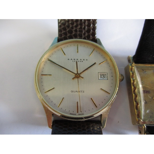 87 - Two 9ct gold cased wristwatches, one by Garrard, neither tested as to function, both with use-relate... 