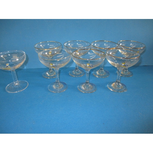 312 - 8 Vintage Babycham glasses, one odd one, all in used condition with no observed damage