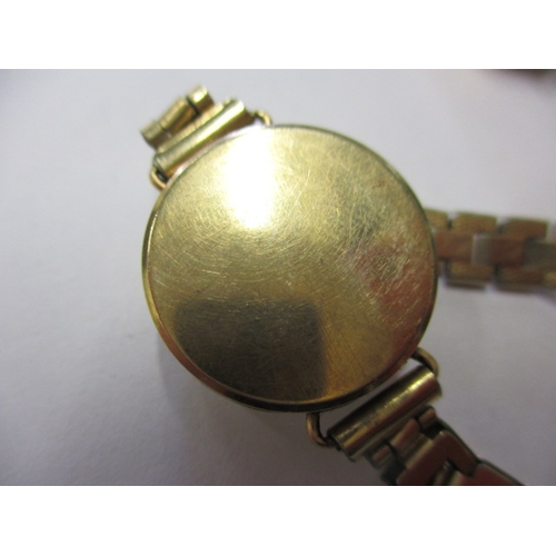 80 - A parcel of gold and yellow metal items, to include 2 gold cased watches, all in used condition with... 