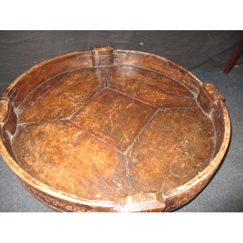 282 - An antique Indian hand carved grain bowl/table, raised on 4 short legs, approx. diameter 76cm in use... 