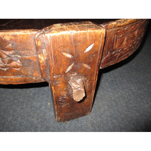 282 - An antique Indian hand carved grain bowl/table, raised on 4 short legs, approx. diameter 76cm in use... 