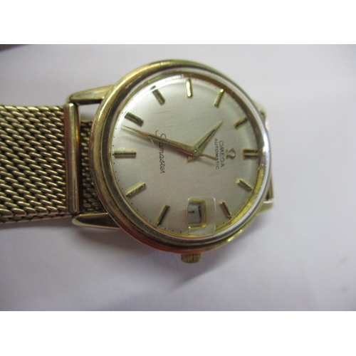 88 - A late 1960’s gold cased Omega automatic Seamaster watch, with 9ct gold mesh strap and date window, ... 