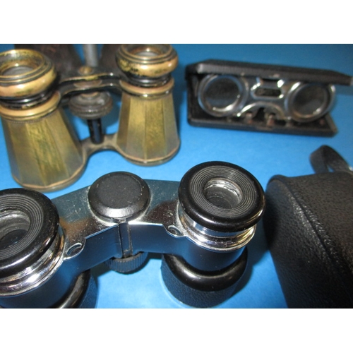 253 - A parcel of vintage binoculars and opera glasses, all in used condition