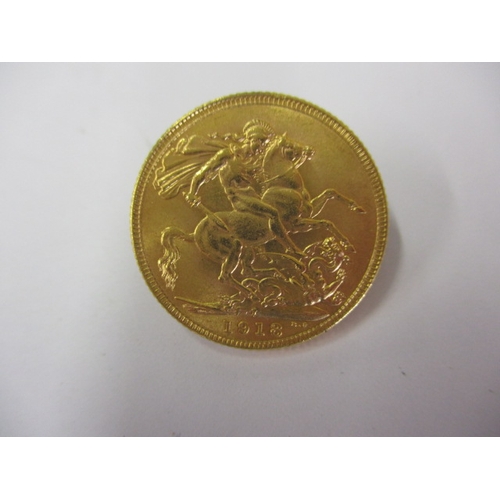 122 - A George V full gold sovereign with Indian mint mark dated 1918, a circulated coin with good definit... 