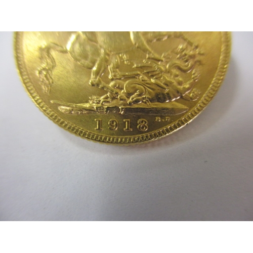 122 - A George V full gold sovereign with Indian mint mark dated 1918, a circulated coin with good definit... 