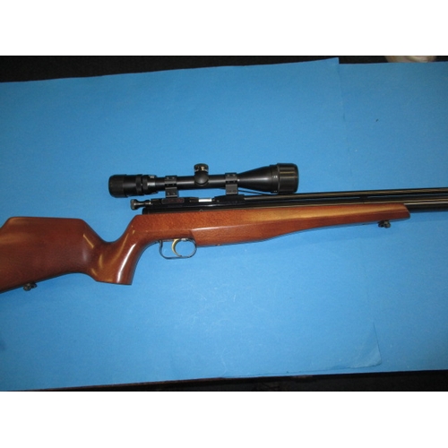 243 - An Air-Arms SM100 .177 air rifle, with telescopic sight, gun slip and user handbook, in very good us... 