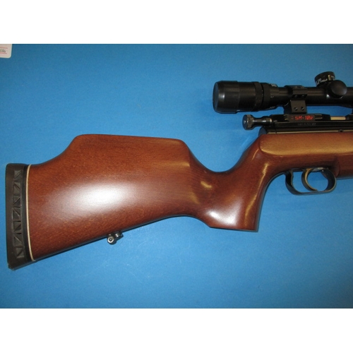 243 - An Air-Arms SM100 .177 air rifle, with telescopic sight, gun slip and user handbook, in very good us... 