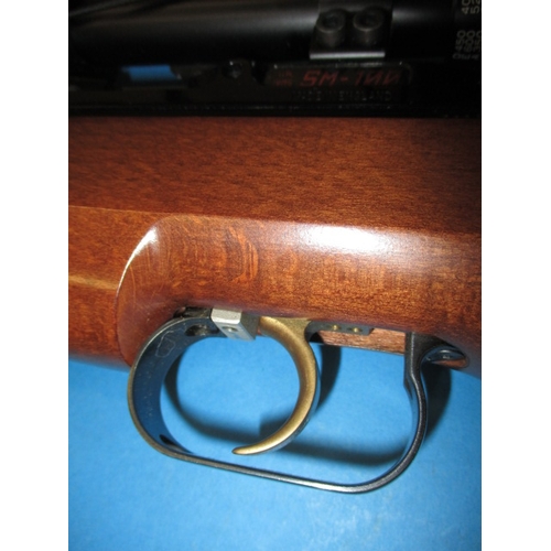 243 - An Air-Arms SM100 .177 air rifle, with telescopic sight, gun slip and user handbook, in very good us... 