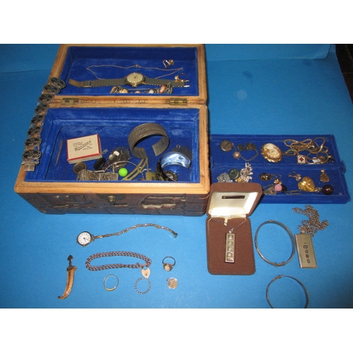 173 - A vintage jewellery box with contents, to include 22ct and 9ct gold items and various silver items, ... 