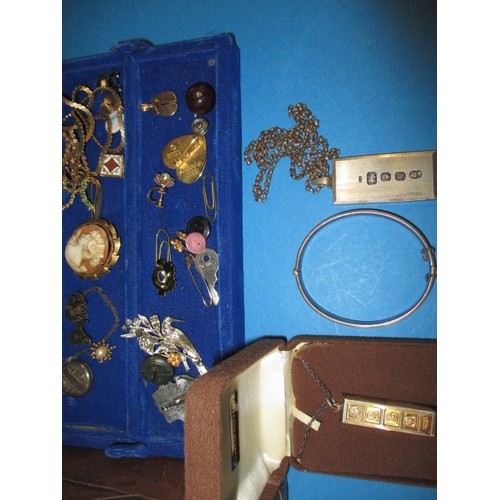 173 - A vintage jewellery box with contents, to include 22ct and 9ct gold items and various silver items, ... 