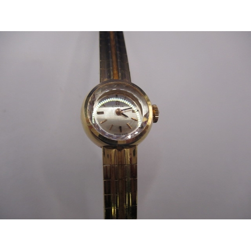 93 - A vintage gold ladies omega wrist watch, with integral strap marked 750, approx. gross weight 34.8g ... 