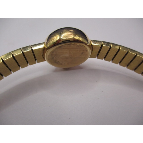 93 - A vintage gold ladies omega wrist watch, with integral strap marked 750, approx. gross weight 34.8g ... 