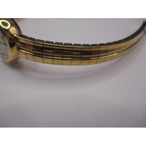 93 - A vintage gold ladies omega wrist watch, with integral strap marked 750, approx. gross weight 34.8g ... 