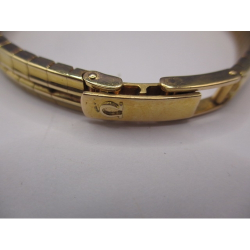 93 - A vintage gold ladies omega wrist watch, with integral strap marked 750, approx. gross weight 34.8g ... 