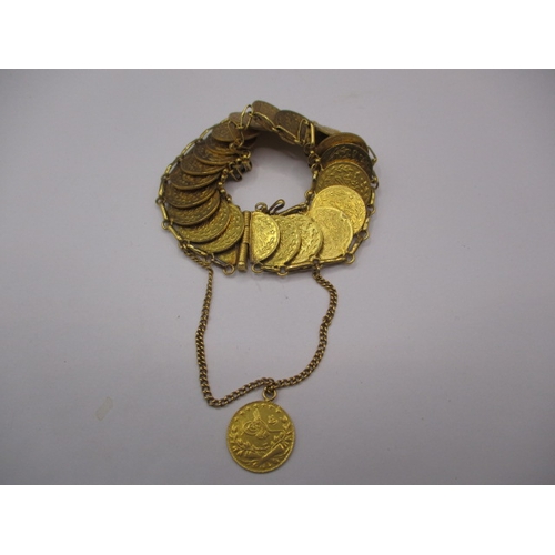 109 - A vintage gold coin bracelet, the coins being Turkish 25 Krush, having 23 in total, approx. gross we... 