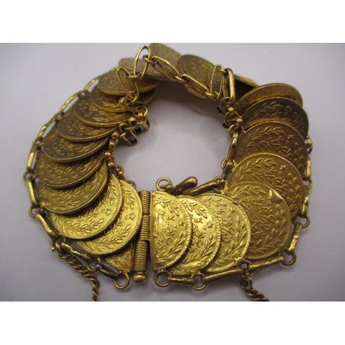 109 - A vintage gold coin bracelet, the coins being Turkish 25 Krush, having 23 in total, approx. gross we... 