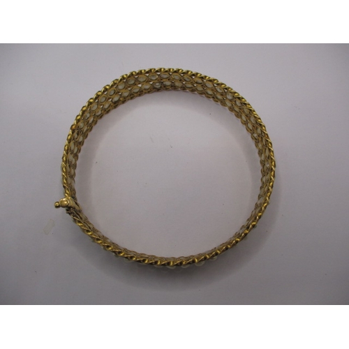 62 - A Bahrain gold and natural seed pearl bangle, clasp pin is stiff, approx. gross weight 19.4g, in vin... 