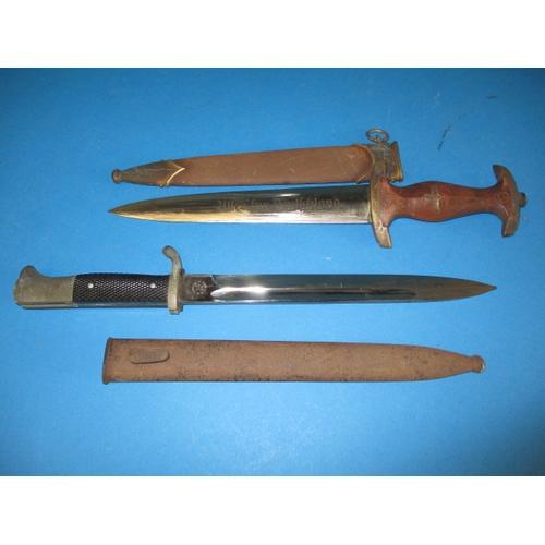 223 - A WWII German Third Reich parade bayonet and a dagger, both genuine period pieces with rust to scabb... 