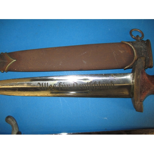 223 - A WWII German Third Reich parade bayonet and a dagger, both genuine period pieces with rust to scabb... 