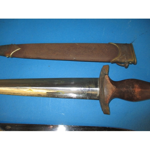 223 - A WWII German Third Reich parade bayonet and a dagger, both genuine period pieces with rust to scabb... 