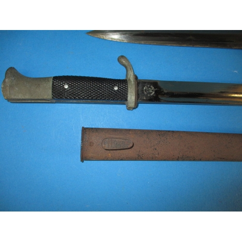 223 - A WWII German Third Reich parade bayonet and a dagger, both genuine period pieces with rust to scabb... 