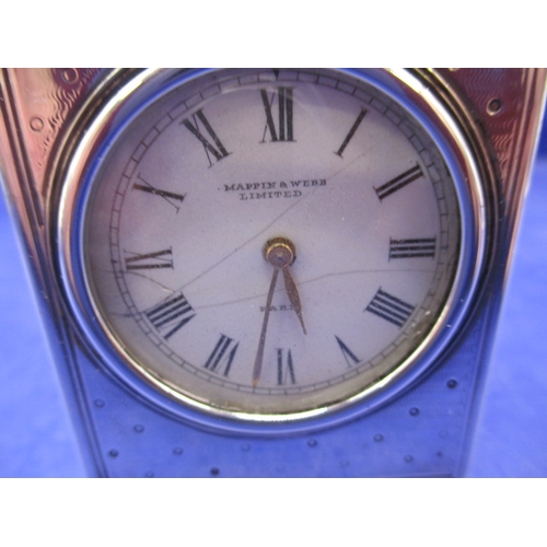 185 - An antique travel clock with hallmarked gold mounts, in current working order striking the hours. Ap... 