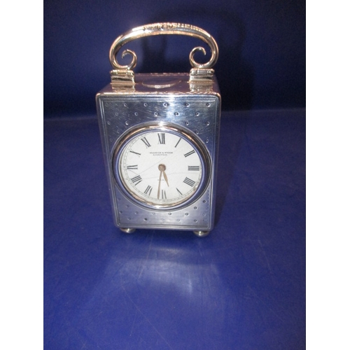 186 - A Mappin & Webb sterling silver miniature clock, approx. height of case 6.5cm in current working ord... 