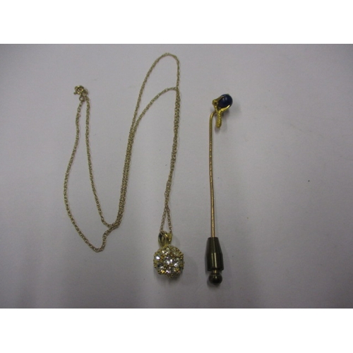 65 - An antique 18ct gold stick pin of a claw holding a Lapis ball, and a 9ct gold necklace chain with de... 