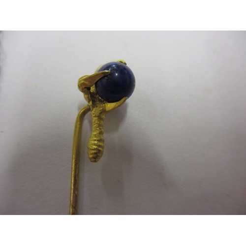 65 - An antique 18ct gold stick pin of a claw holding a Lapis ball, and a 9ct gold necklace chain with de... 