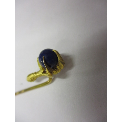 65 - An antique 18ct gold stick pin of a claw holding a Lapis ball, and a 9ct gold necklace chain with de... 