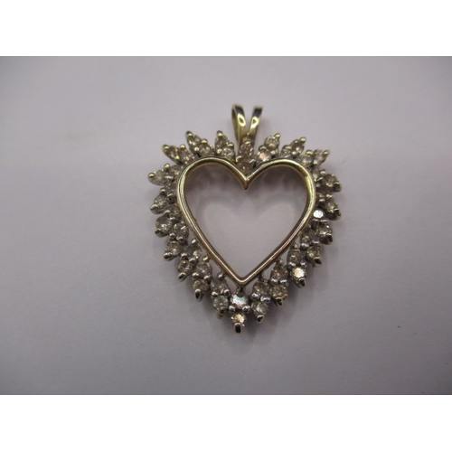 69 - A 9ct yellow gold and diamond heart shaped necklace pendant, approx. total diamond ct weight being 1... 