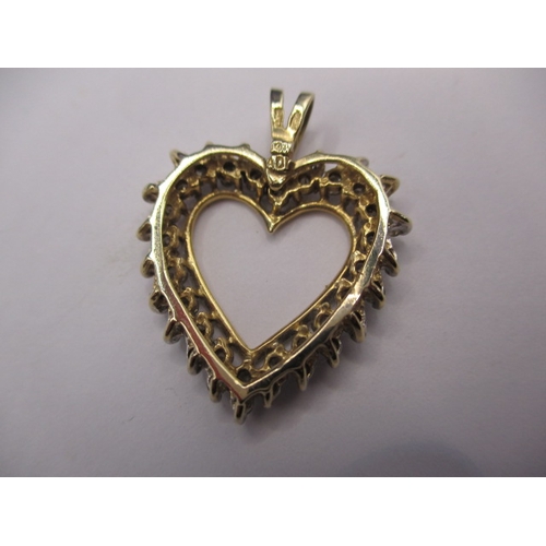 69 - A 9ct yellow gold and diamond heart shaped necklace pendant, approx. total diamond ct weight being 1... 