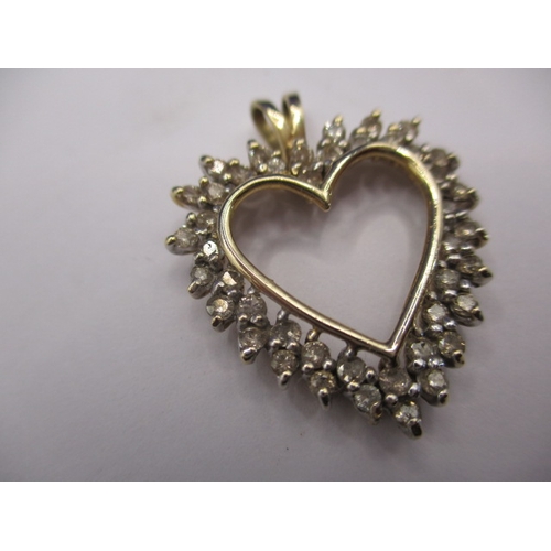 69 - A 9ct yellow gold and diamond heart shaped necklace pendant, approx. total diamond ct weight being 1... 