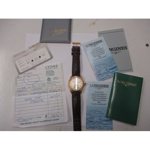 A gents Longines 125 year anniversary watch with paperwork and