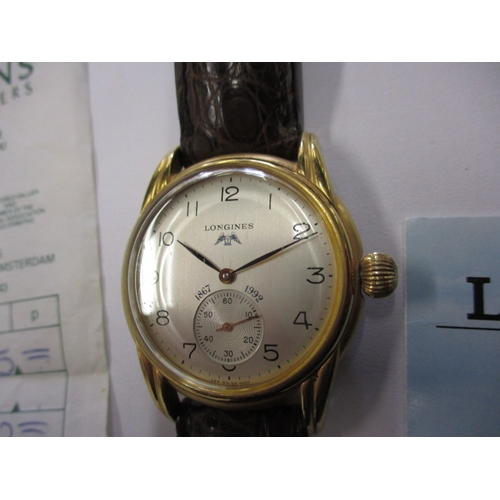 A gents Longines 125 year anniversary watch with paperwork and