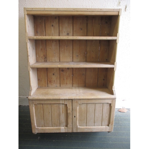 294 - A 19th century waxed pine wall mounted kitchen unit, consisting of shelves above doored cabinet, app... 