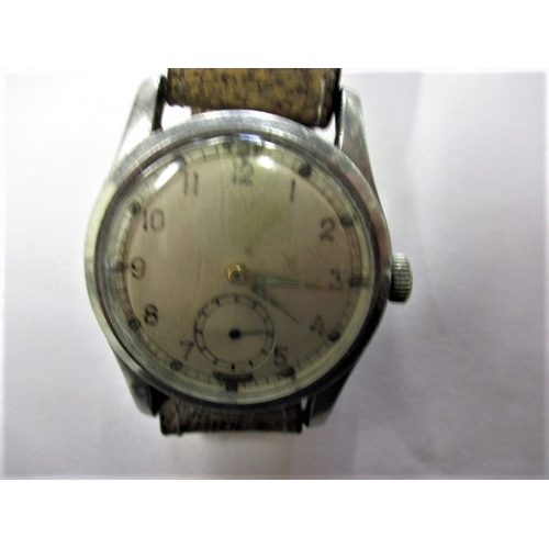 104 - A 1940s WWII Army Trade pattern A.T.P. watch, in current working order with general use-related mark... 