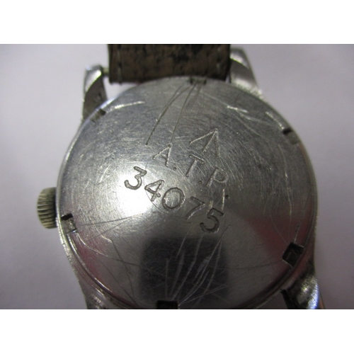 104 - A 1940s WWII Army Trade pattern A.T.P. watch, in current working order with general use-related mark... 