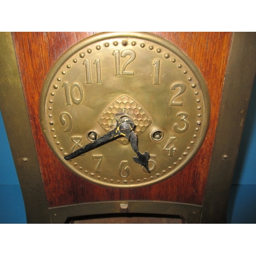 285 - An early 20th century Arts & Craft mantle clock, striking on a  bell with oak and brass body, with k... 