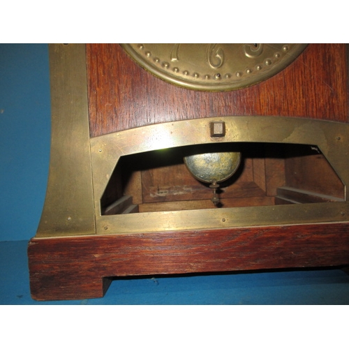 285 - An early 20th century Arts & Craft mantle clock, striking on a  bell with oak and brass body, with k... 