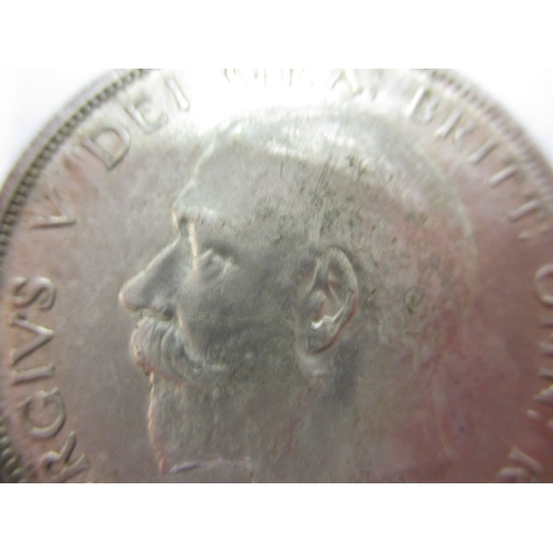 135 - A George V crown dated 1930 and a half crown dated 1916, circulated coins with very fine definition ... 