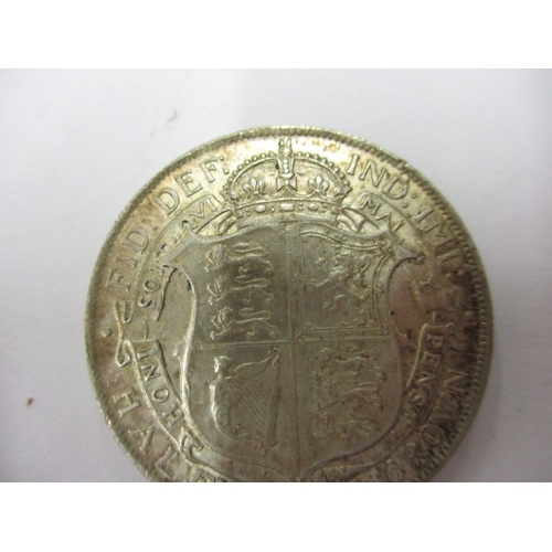 135 - A George V crown dated 1930 and a half crown dated 1916, circulated coins with very fine definition ... 