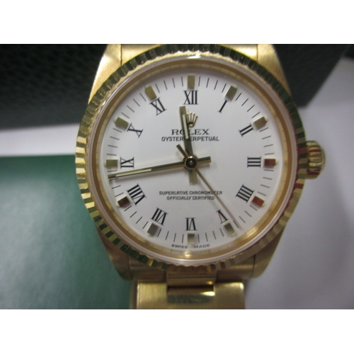 98 - A 2004 gold Rolex Oyster perpetual chronometer 77518, being marked for 18ct gold with original box a... 