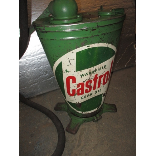 323 - A vintage Castrol gear oil dispenser, hand cranked with original hose, having general use-related ma... 